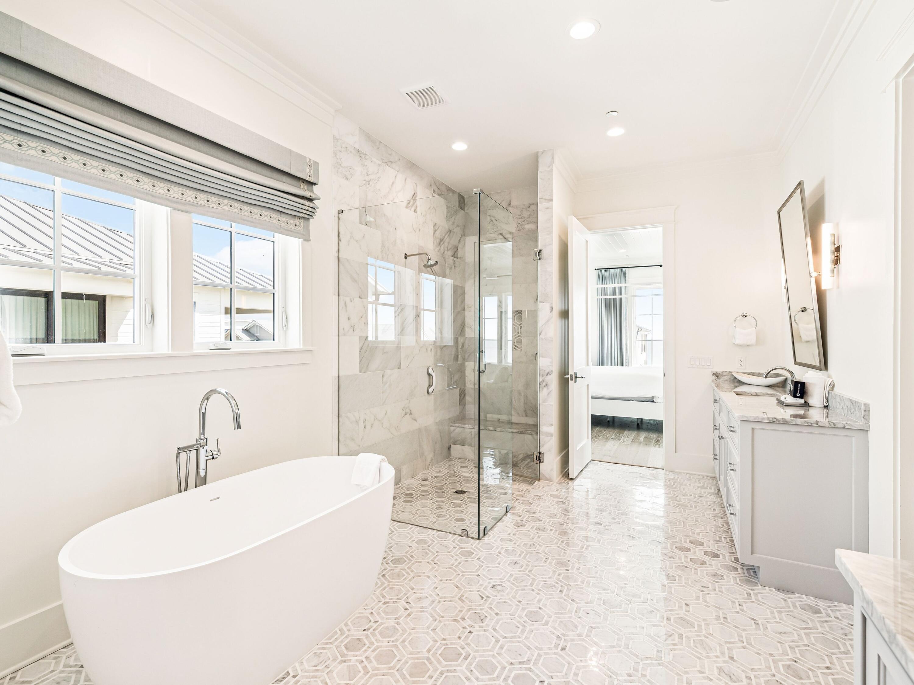 91 Emerald Cove Lane North Inlet Beach, FL 32461 - Photo 50 of 53 a bathroom with a tub sink and mirror