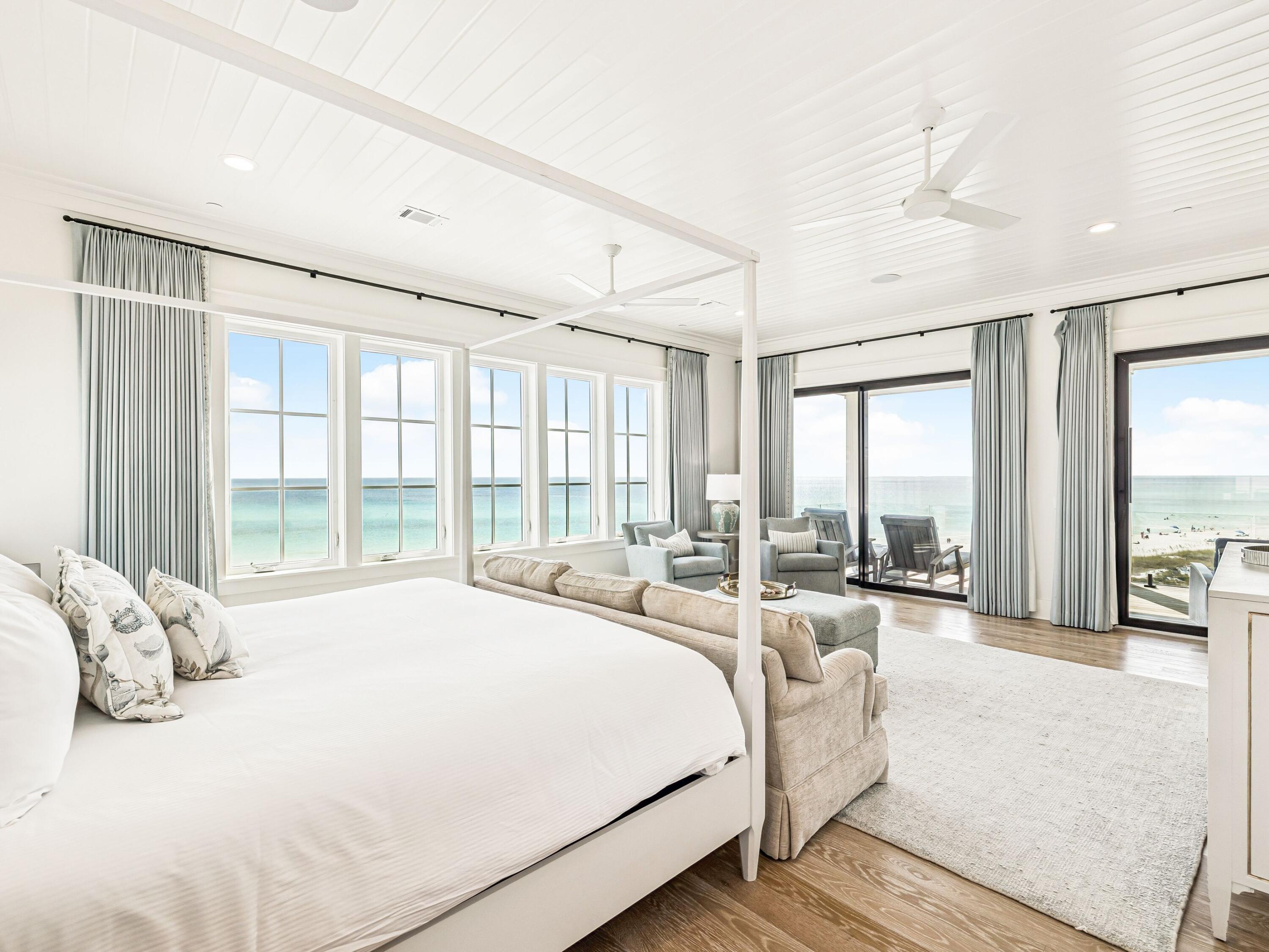 91 Emerald Cove Lane North Inlet Beach, FL 32461 - Photo 7 of 53 a spacious bedroom with a large bed and a large window