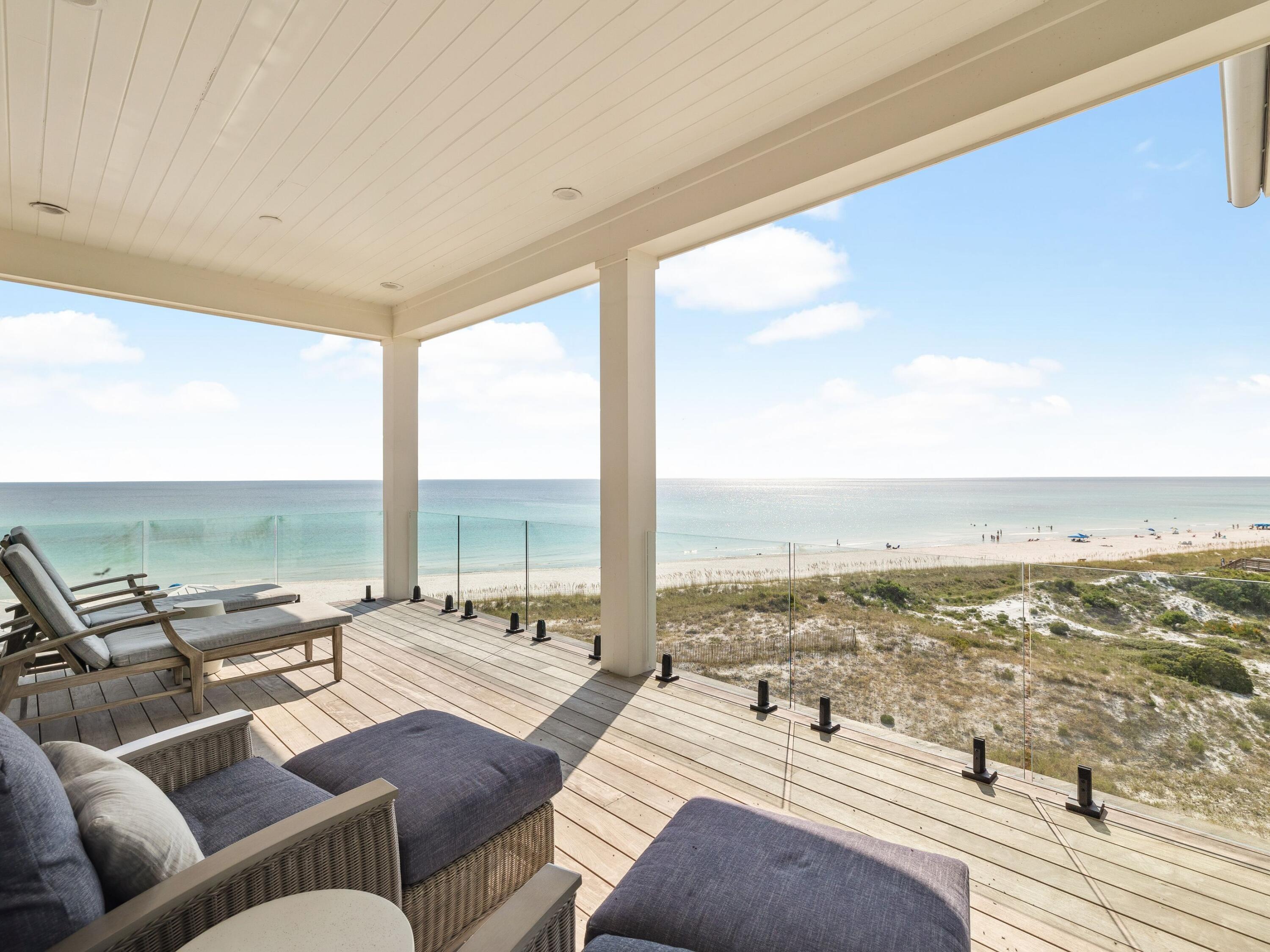 91 Emerald Cove Lane North Inlet Beach, FL 32461 - Photo 8 of 53 a living room with furniture and floor to ceiling windows