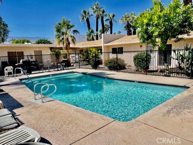 73740 Santa Rosa Way, Unit 5 Palm Desert, CA 92260 - Photo 2 of 20 a view of a house with swimming pool and sitting area