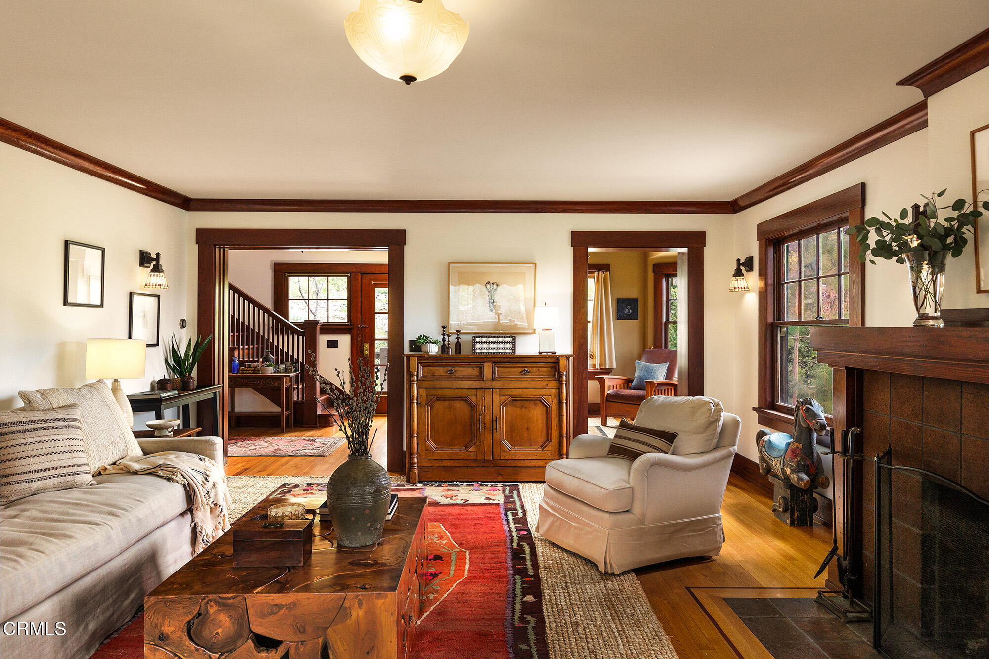 455 La Loma Road Pasadena, CA 91105 - Photo 6 of 21 a living room with furniture and a fireplace