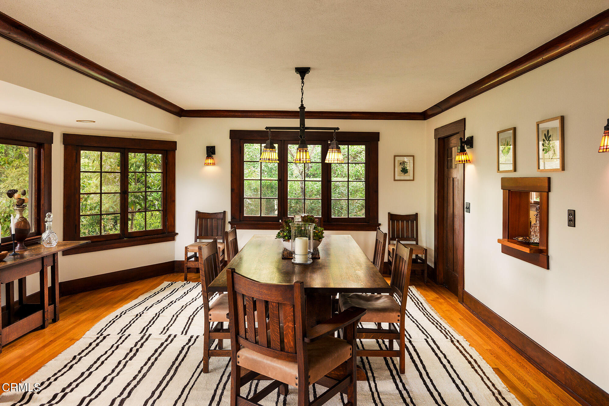 455 La Loma Road Pasadena, CA 91105 - Photo 8 of 21 a dining room with furniture a chandelier and wooden floor