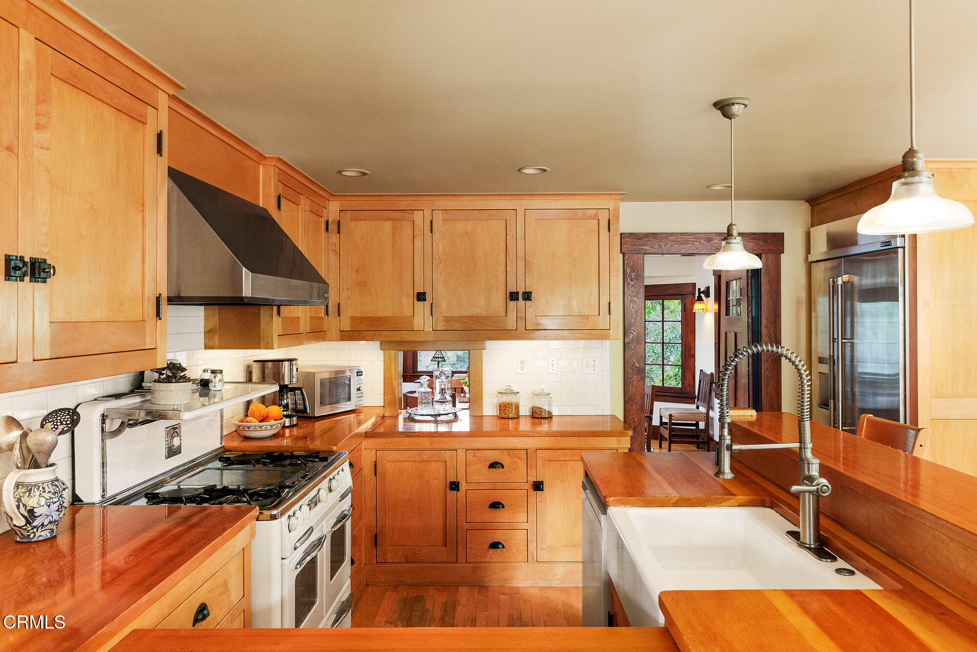 455 La Loma Road Pasadena, CA 91105 - Photo 9 of 21 a kitchen with stainless steel appliances granite countertop a sink stove and cabinets