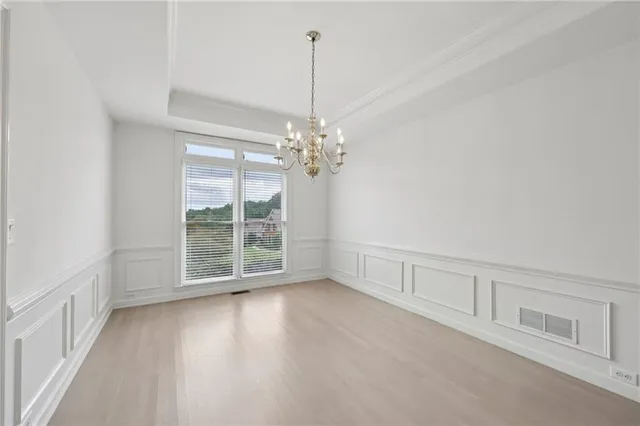 an empty room with a empty space and windows