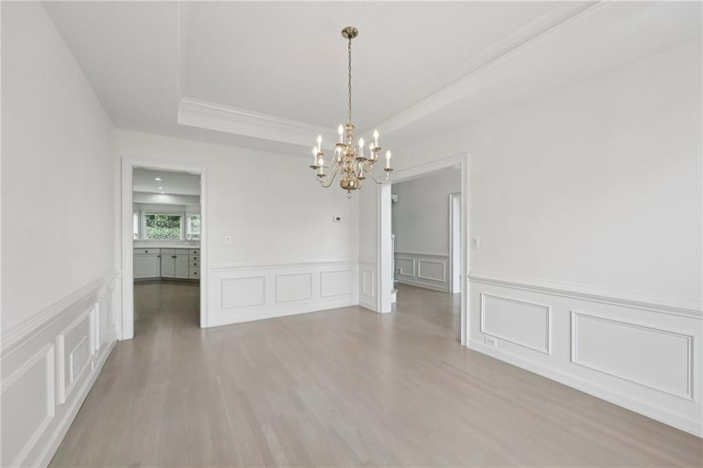 3540 Hickory Branch Trail Suwanee, GA 30024 - Photo 14 of 69 a view of a room with cabinet and chandelier