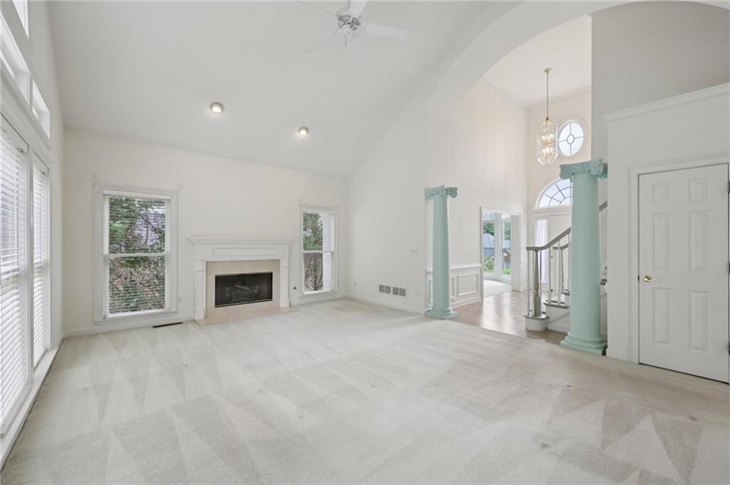 3540 Hickory Branch Trail Suwanee, GA 30024 - Photo 16 of 69 a view of empty room with a fireplace and fan