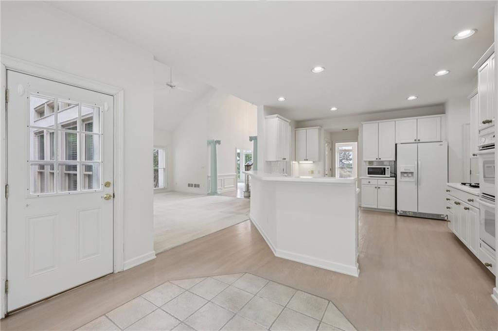 3540 Hickory Branch Trail Suwanee, GA 30024 - Photo 21 of 69 a view of a kitchen with refrigerator and windows