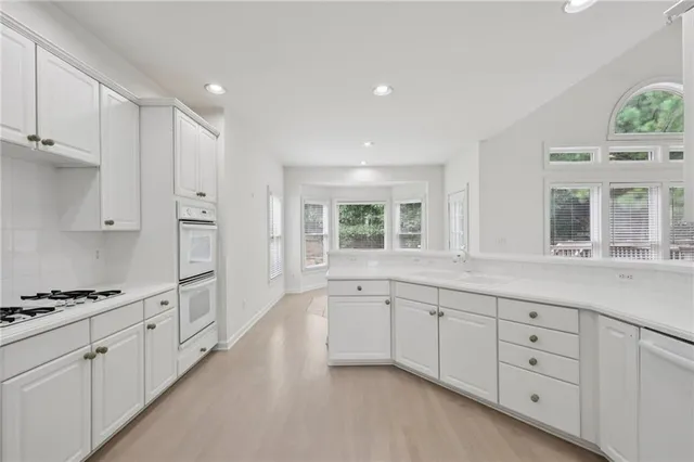 a view of an empty room and closet area