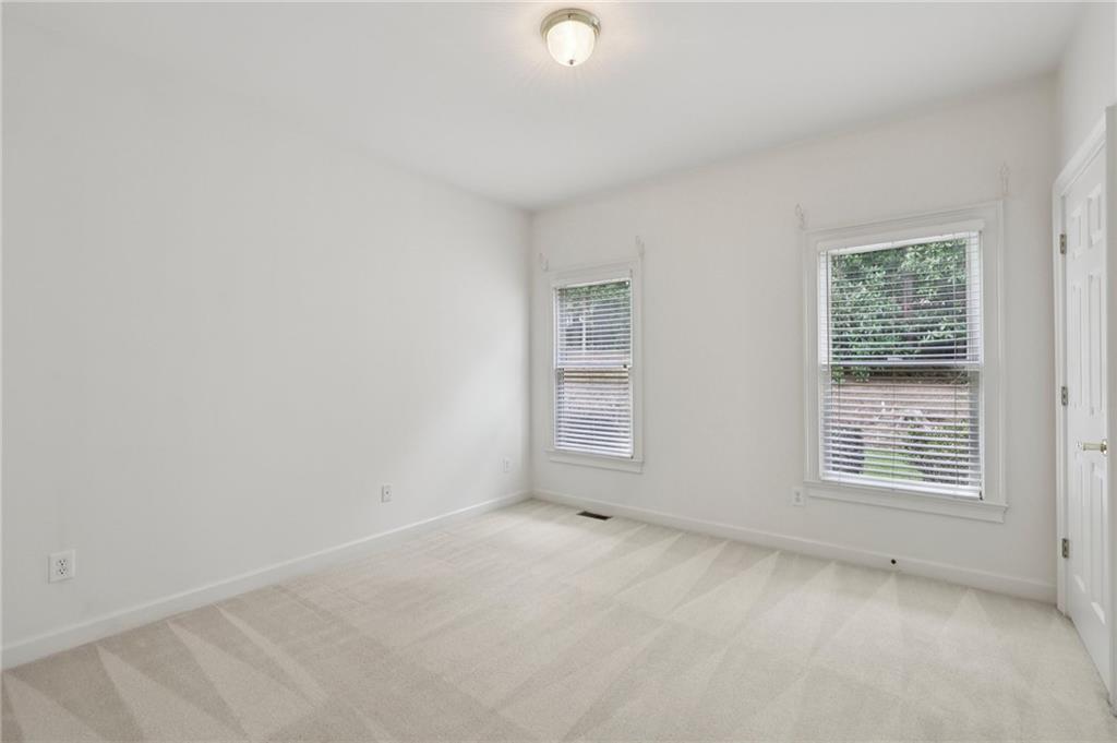 3540 Hickory Branch Trail Suwanee, GA 30024 - Photo 28 of 69 an empty room with windows