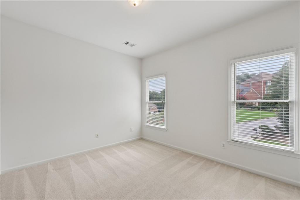 3540 Hickory Branch Trail Suwanee, GA 30024 - Photo 32 of 69 a view of an empty room with a window