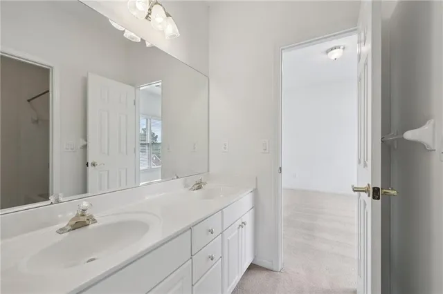 a view of a bathroom with a shower and a sink
