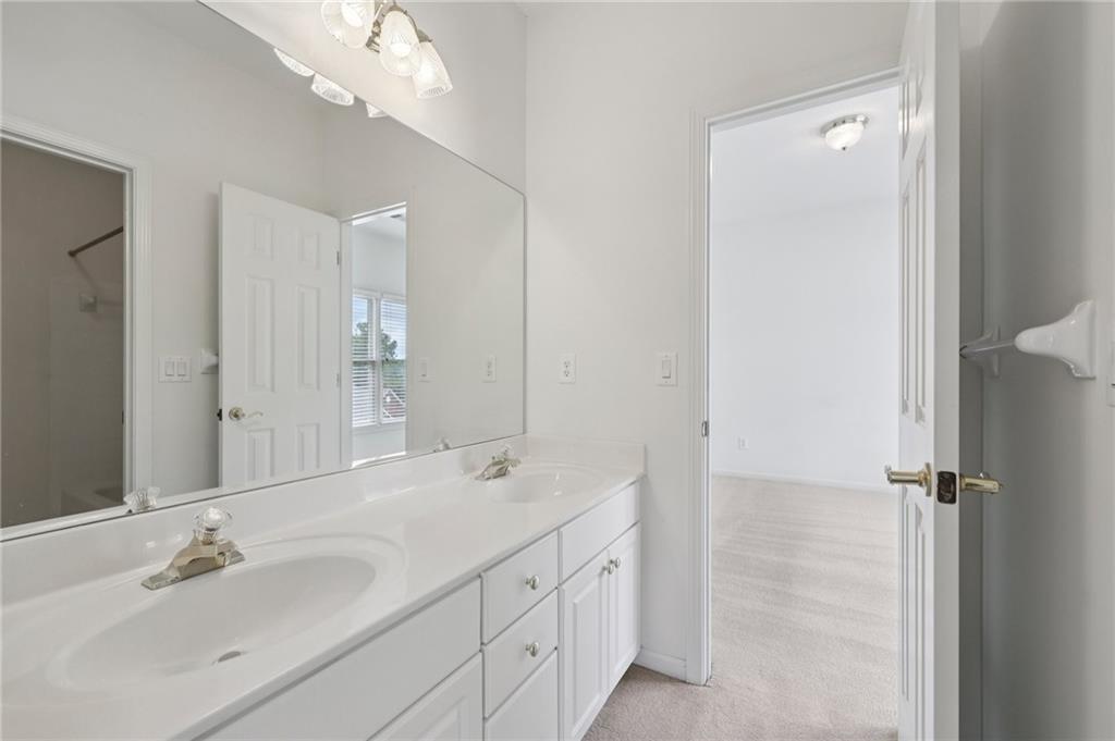 3540 Hickory Branch Trail Suwanee, GA 30024 - Photo 34 of 69 a bathroom with a double vanity sink mirror and double