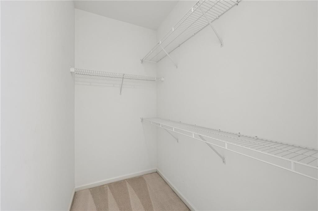 3540 Hickory Branch Trail Suwanee, GA 30024 - Photo 41 of 69 a view of a room with racks on the wall