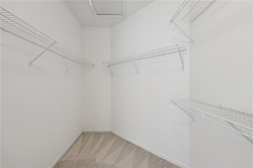 3540 Hickory Branch Trail Suwanee, GA 30024 - Photo 42 of 69 a view of a room with racks on the wall