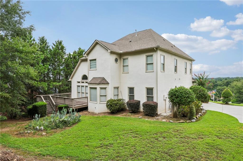 3540 Hickory Branch Trail Suwanee, GA 30024 - Photo 52 of 69 a house view with a garden space