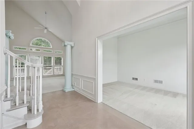 a view of an empty room with a window