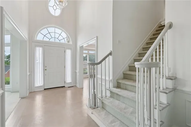 a view of a room with cabinet and chandelier