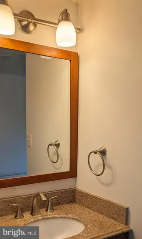 a bathroom with a sink and mirror