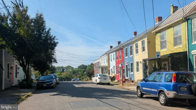 a view of street with parked cars