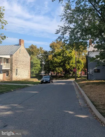 a view of a street with a building in the background