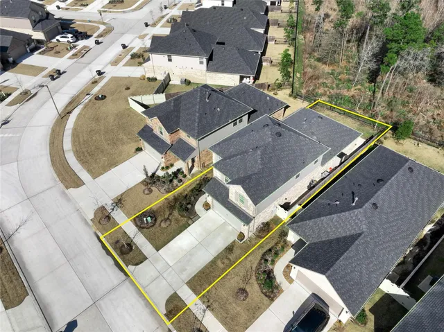 a front view of a house with a garden and plants