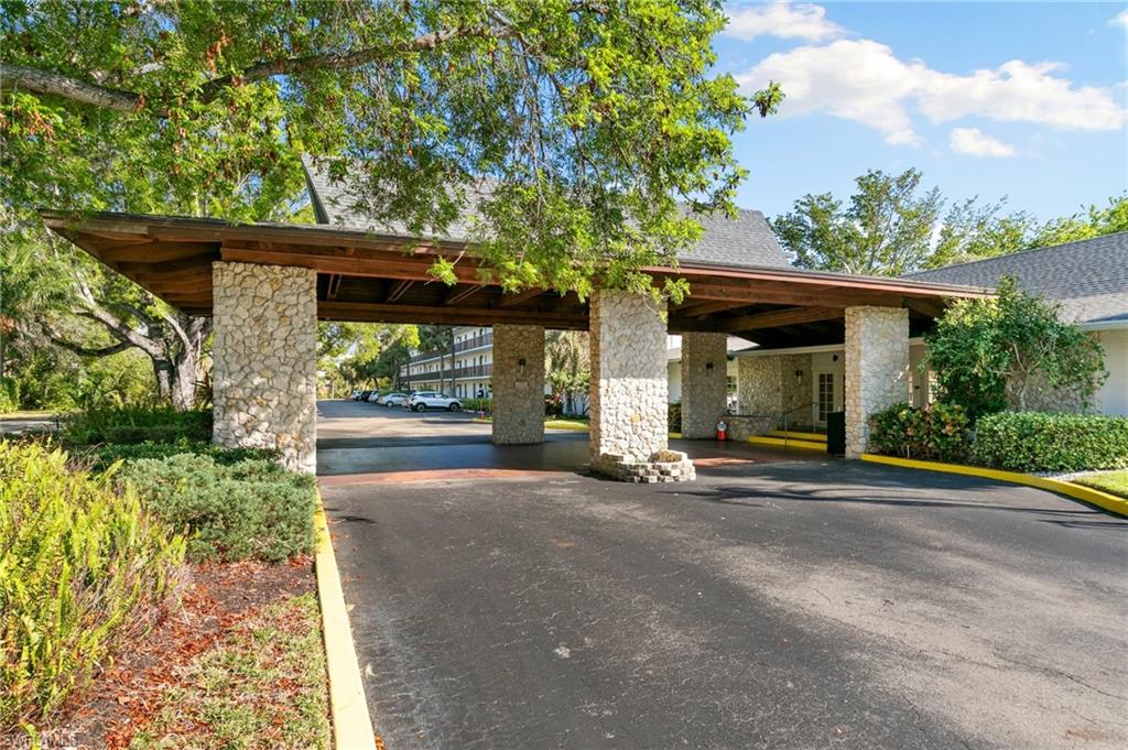 600 Neapolitan Way, Unit 257 Naples, FL 34103 - Photo 21 of 35 a view of a car park in front of a house