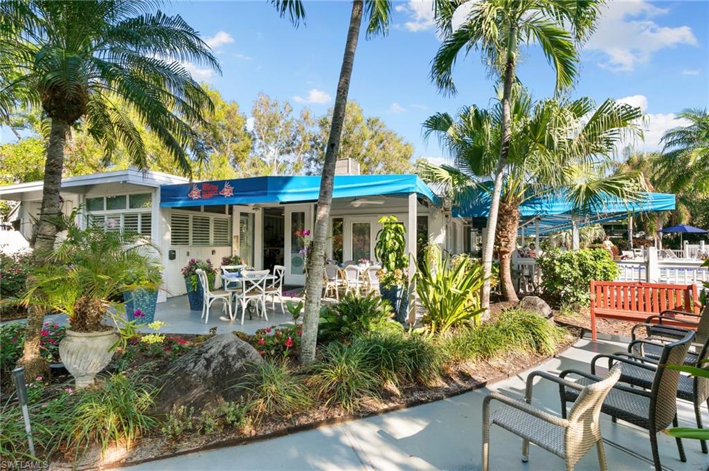 600 Neapolitan Way, Unit 257 Naples, FL 34103 - Photo 28 of 35 a view of a house with a patio