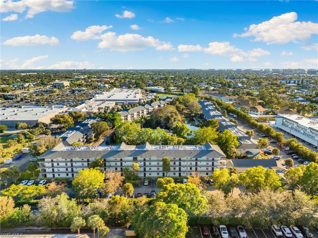 600 Neapolitan Way, Unit 257 Naples, FL 34103 - Photo 33 of 35 an aerial view of residential houses with outdoor space