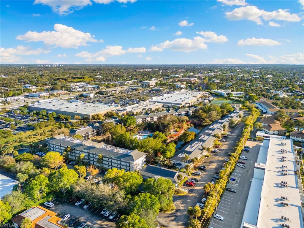 600 Neapolitan Way, Unit 257 Naples, FL 34103 - Photo 34 of 35 an aerial view of residential houses with outdoor space