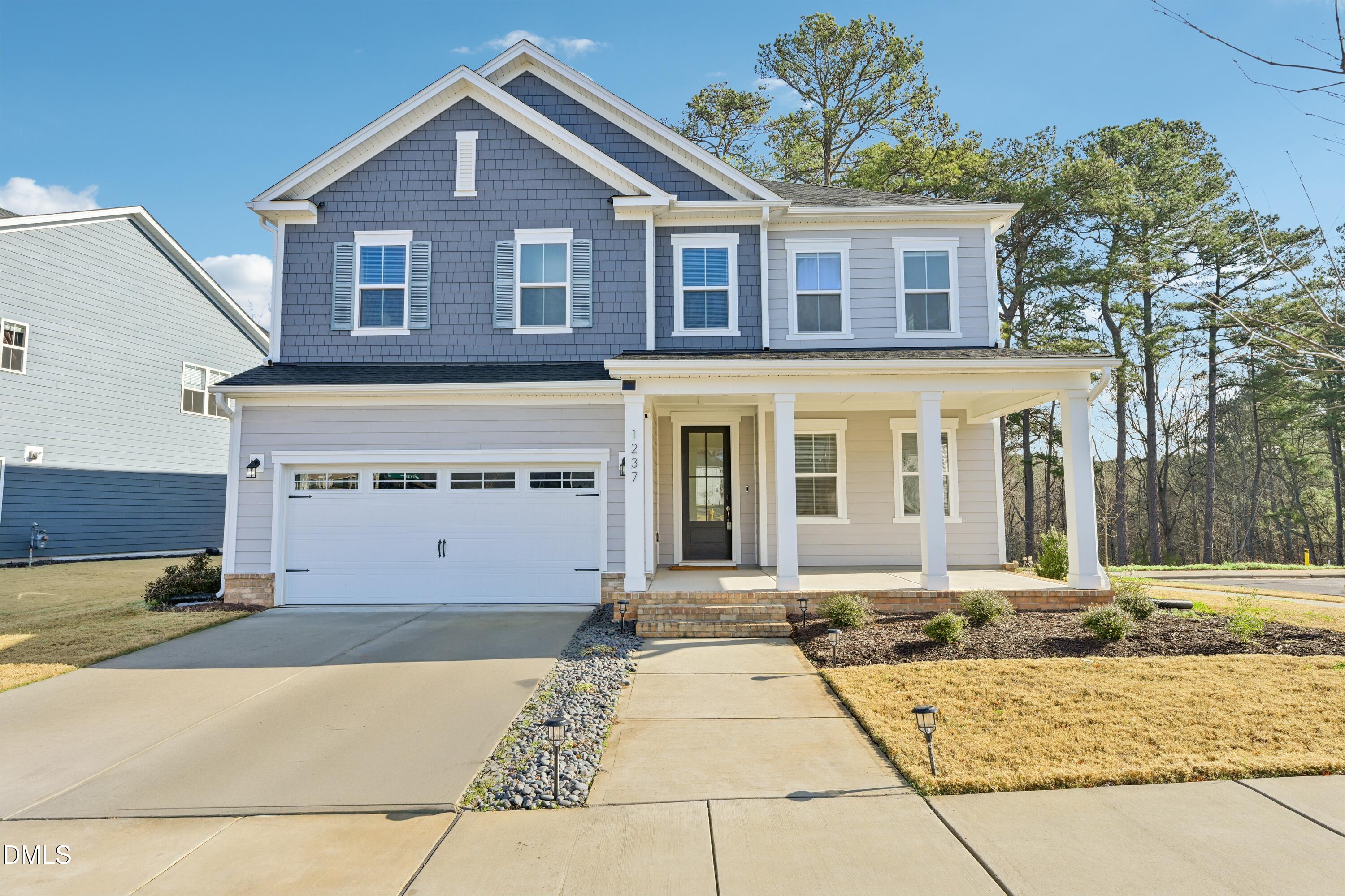 1237 Remey Avenue Wake Forest, NC 27587 - Photo 1 of 40 a front view of a house with a yard