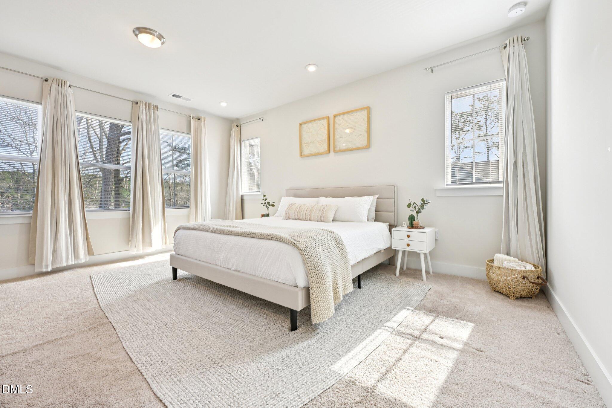 1237 Remey Avenue Wake Forest, NC 27587 - Photo 15 of 40 a bedroom with a large bed and a window