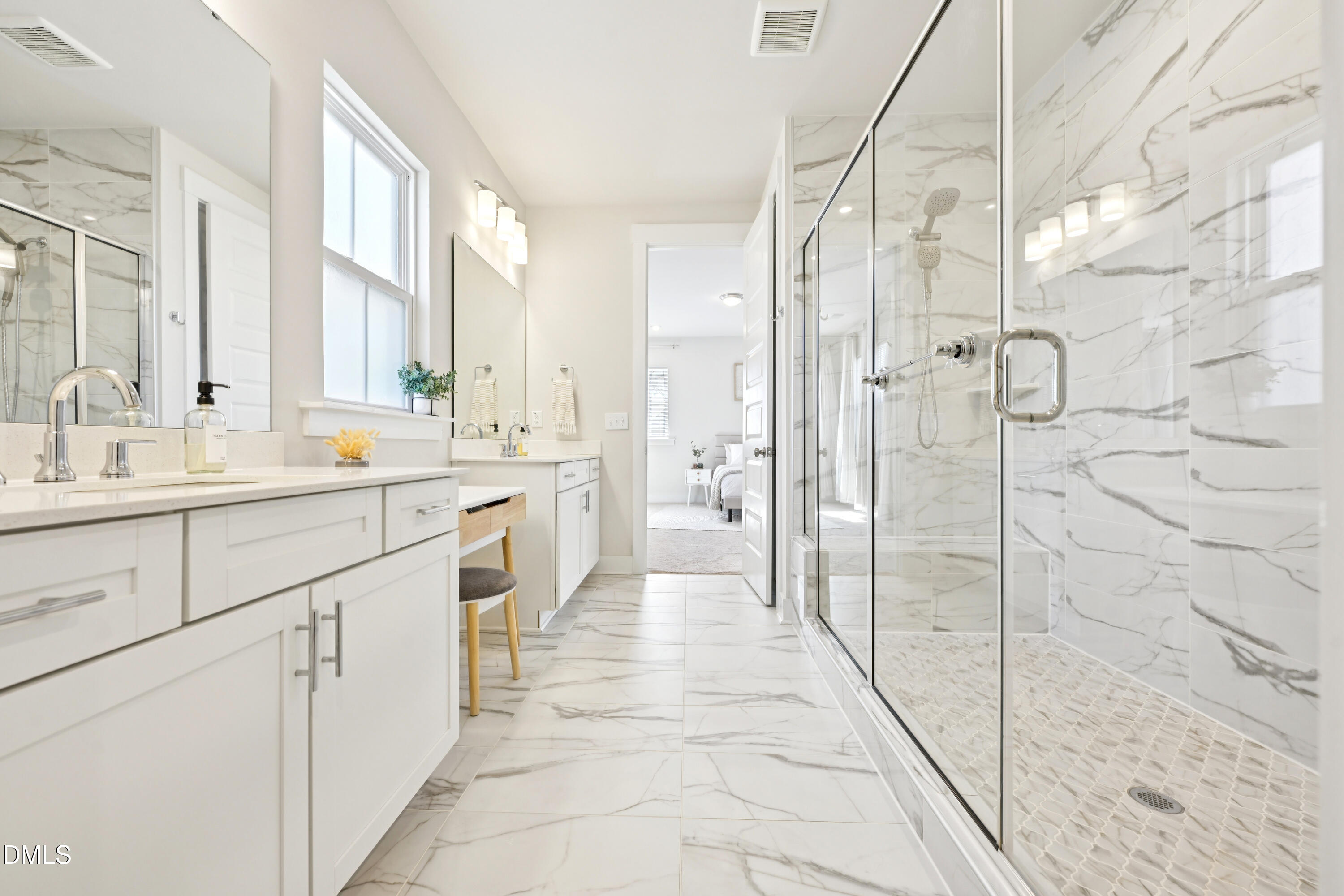 1237 Remey Avenue Wake Forest, NC 27587 - Photo 18 of 40 a large white bathroom with a double vanity sink a mirror and a shower