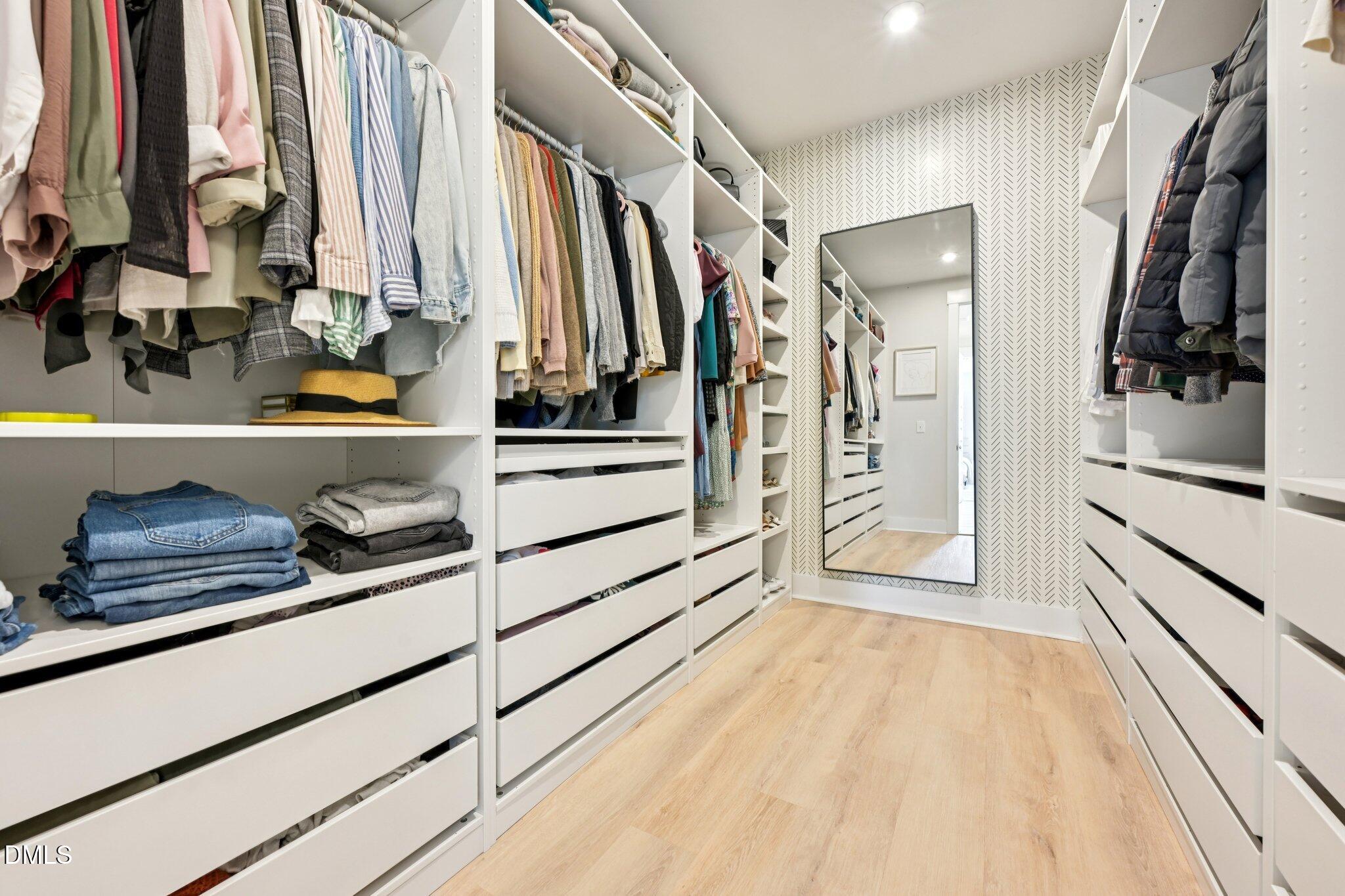 1237 Remey Avenue Wake Forest, NC 27587 - Photo 19 of 40 a view of walk in closet with clothes and shoes