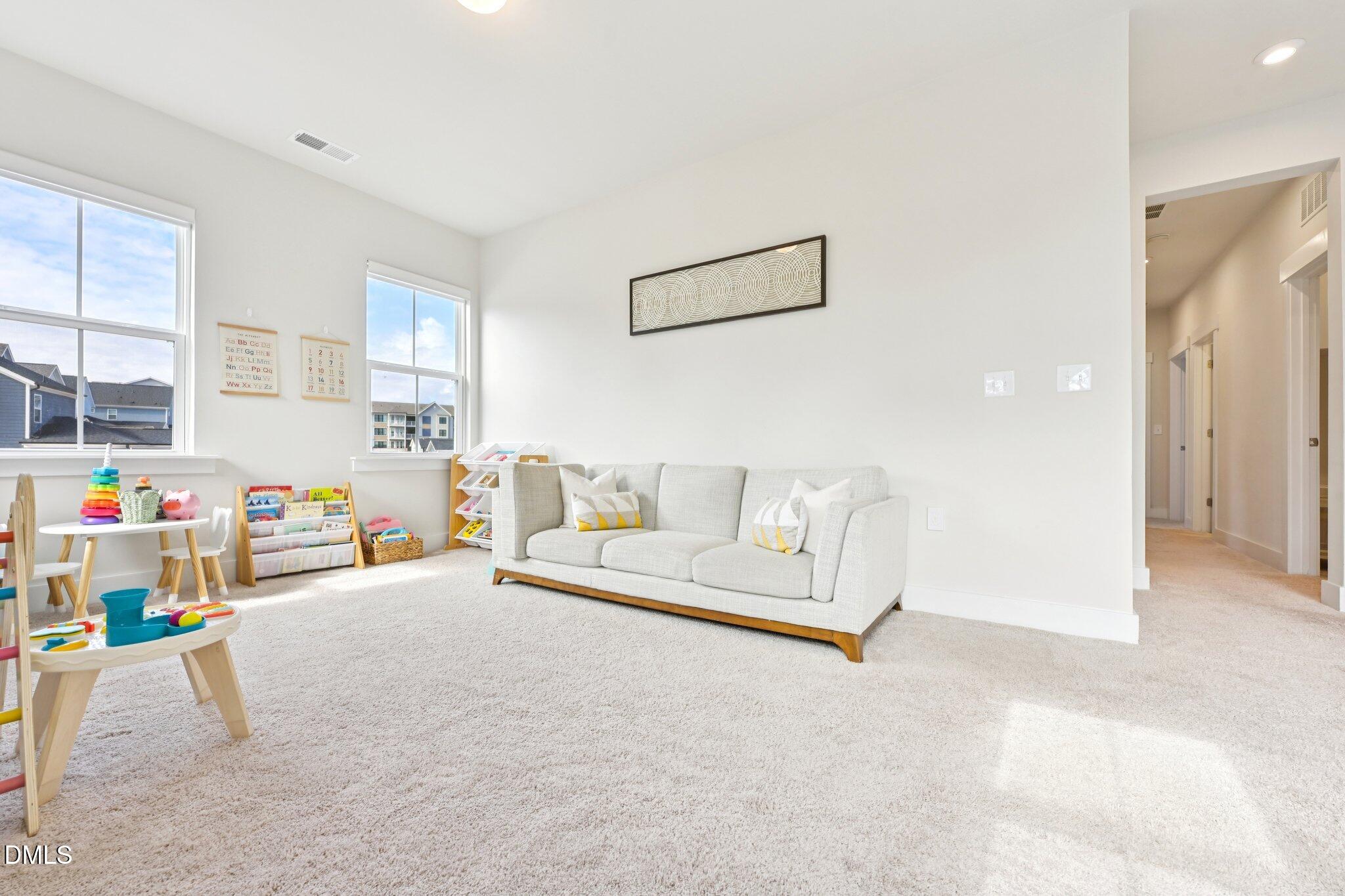 1237 Remey Avenue Wake Forest, NC 27587 - Photo 22 of 40 a living room with furniture and a window