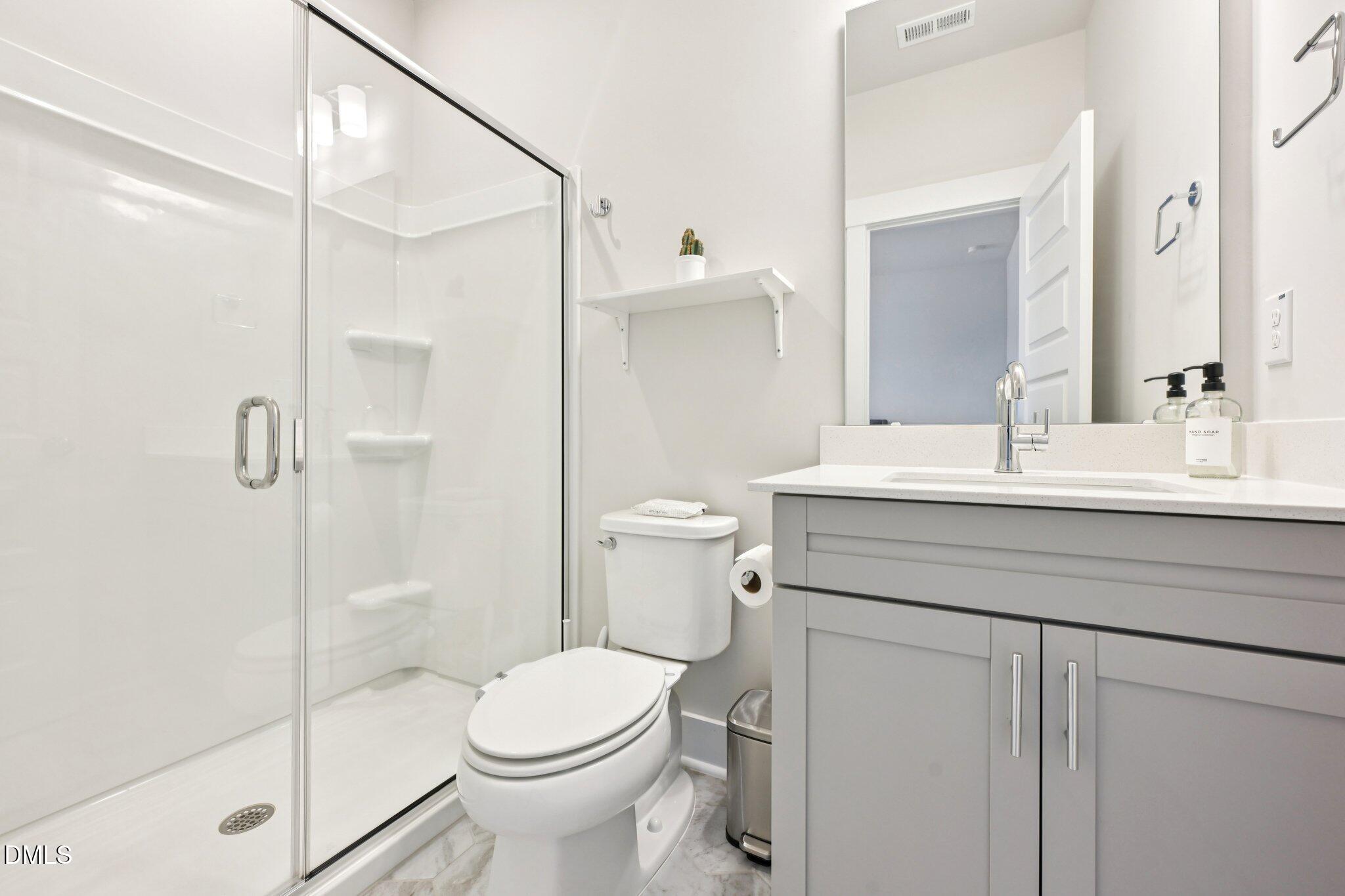 1237 Remey Avenue Wake Forest, NC 27587 - Photo 26 of 40 a bathroom with a sink toilet and shower