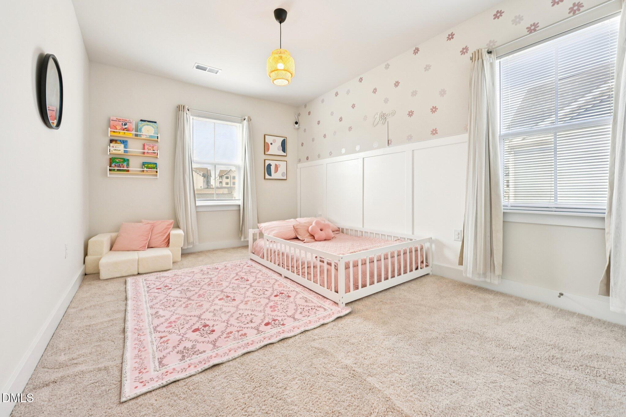 1237 Remey Avenue Wake Forest, NC 27587 - Photo 27 of 40 a bedroom with a bed and a window
