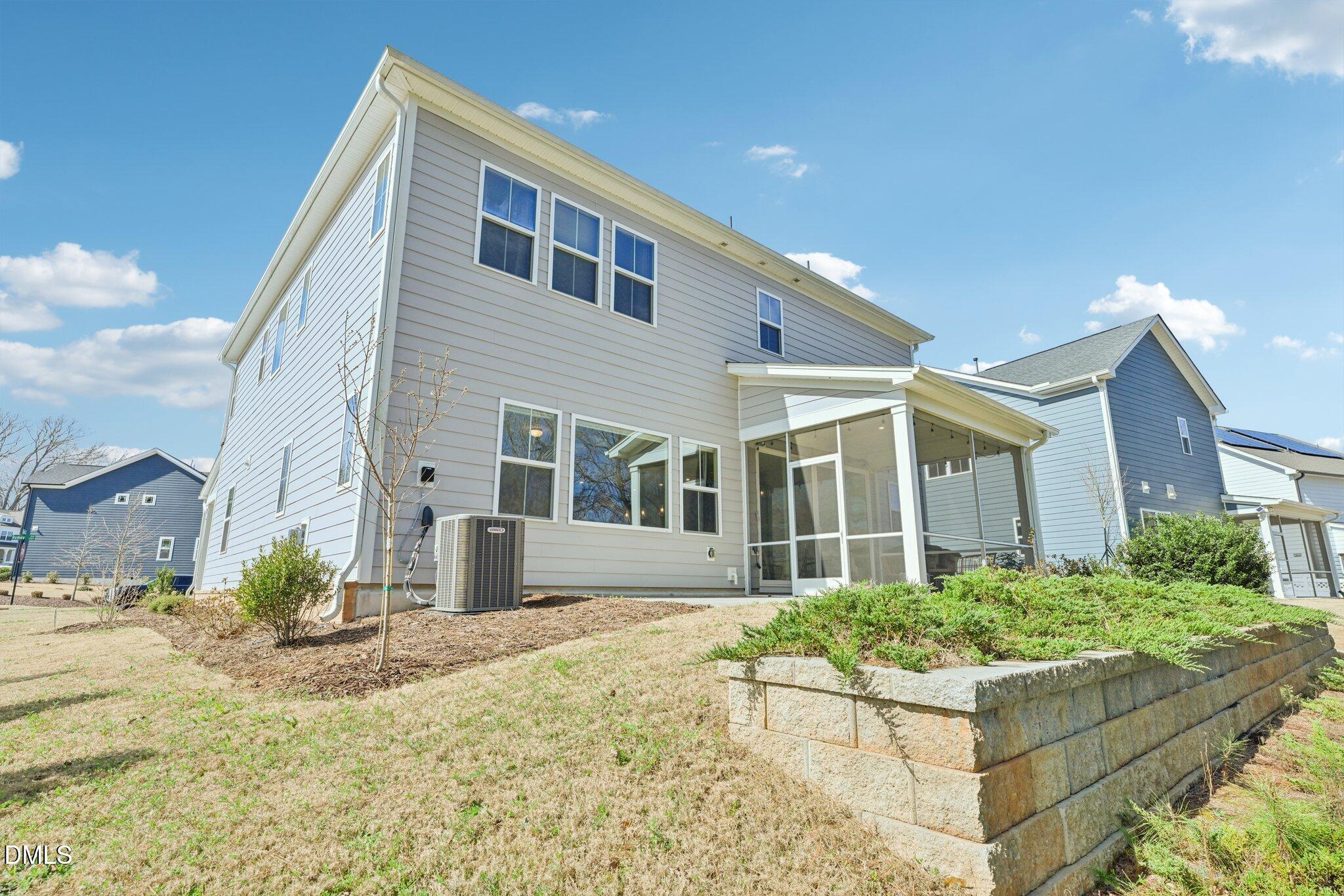 1237 Remey Avenue Wake Forest, NC 27587 - Photo 32 of 40 a front view of a house with a yard