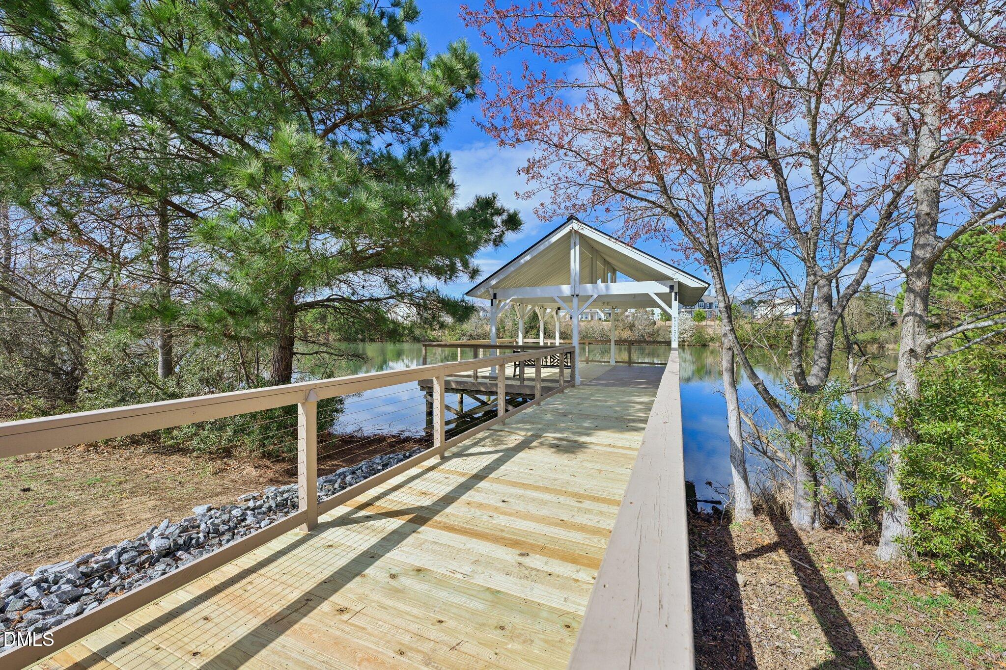 1237 Remey Avenue Wake Forest, NC 27587 - Photo 38 of 40 a view of a house with wooden deck next to a yard