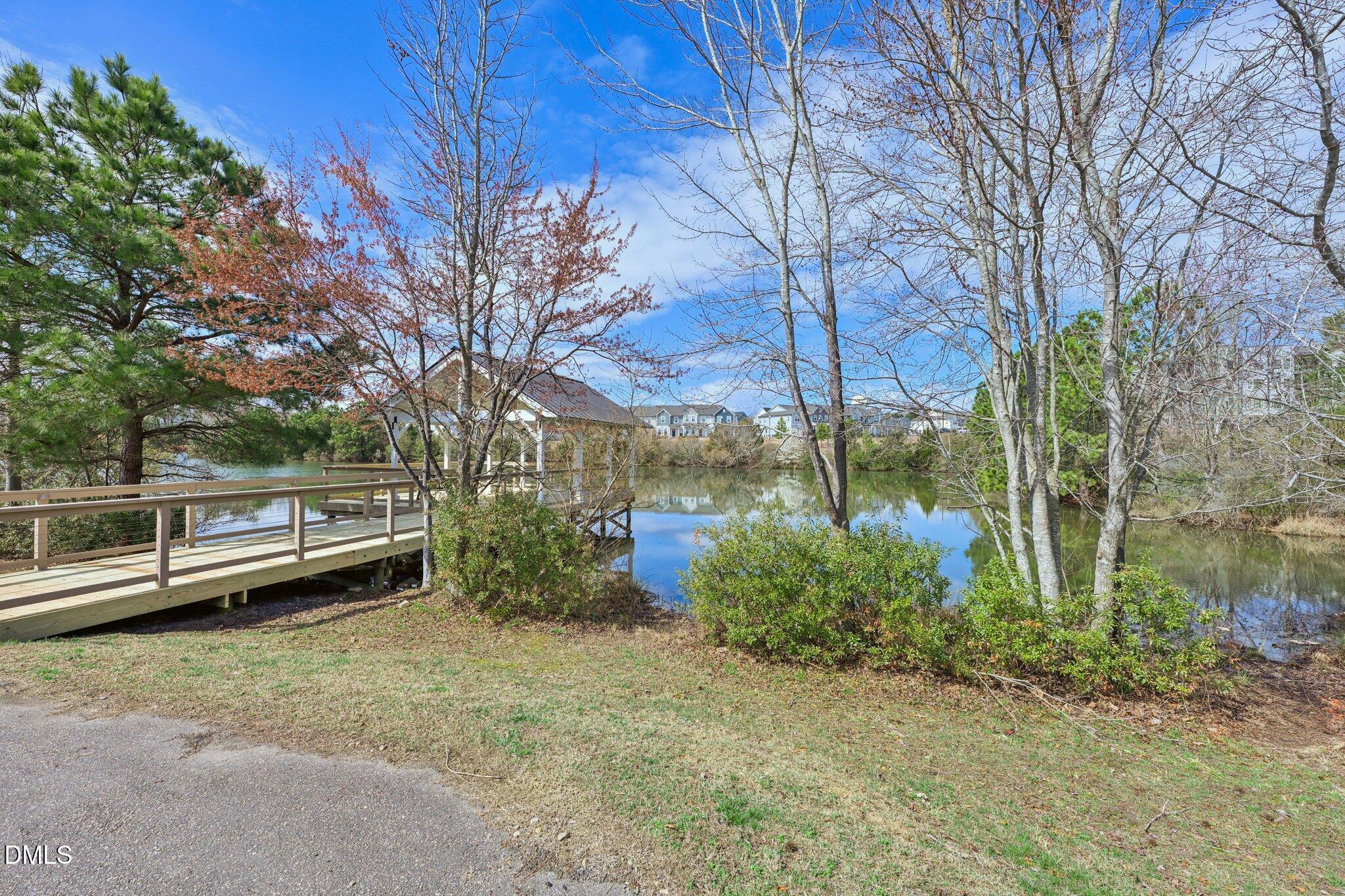 1237 Remey Avenue Wake Forest, NC 27587 - Photo 39 of 40 a view of a backyard with plants and lake view