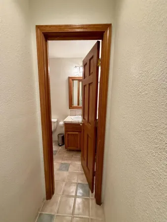 a view of a bedroom from a hallway