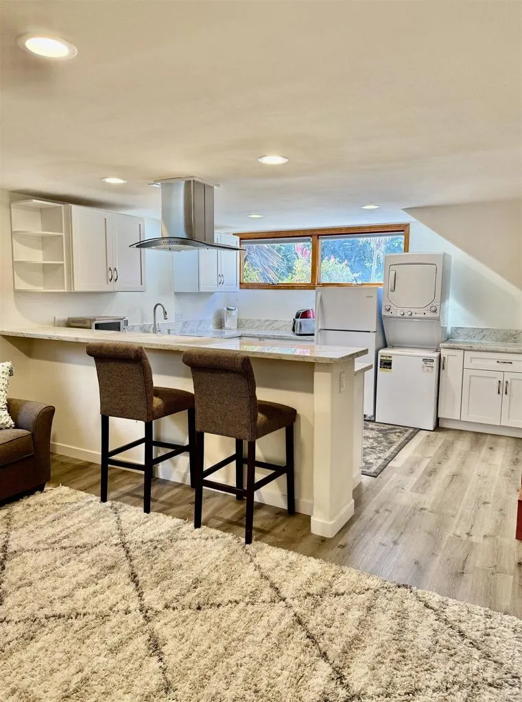 2538 Foothill Drive, Unit B Vista, CA 92084 - Photo 5 of 16 a kitchen with stainless steel appliances kitchen island granite countertop a sink and cabinets