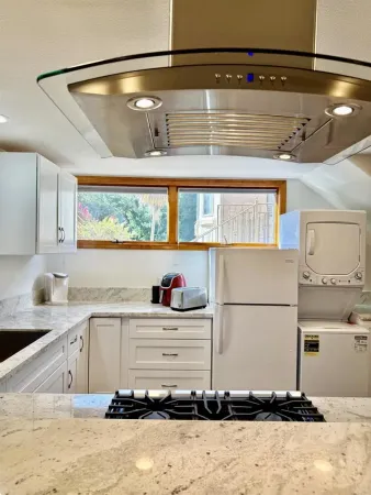 a kitchen with a refrigerator and a sink