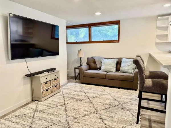 a living room with furniture and a flat screen tv