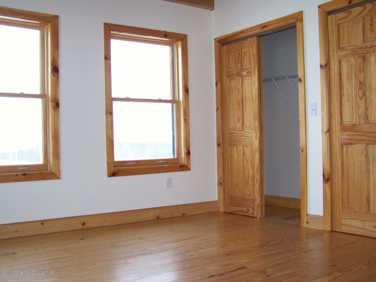 1018 Rattlesnake Hill Road Meshoppen, PA 18630 - Photo 16 of 26 an empty room with window and wooden floor