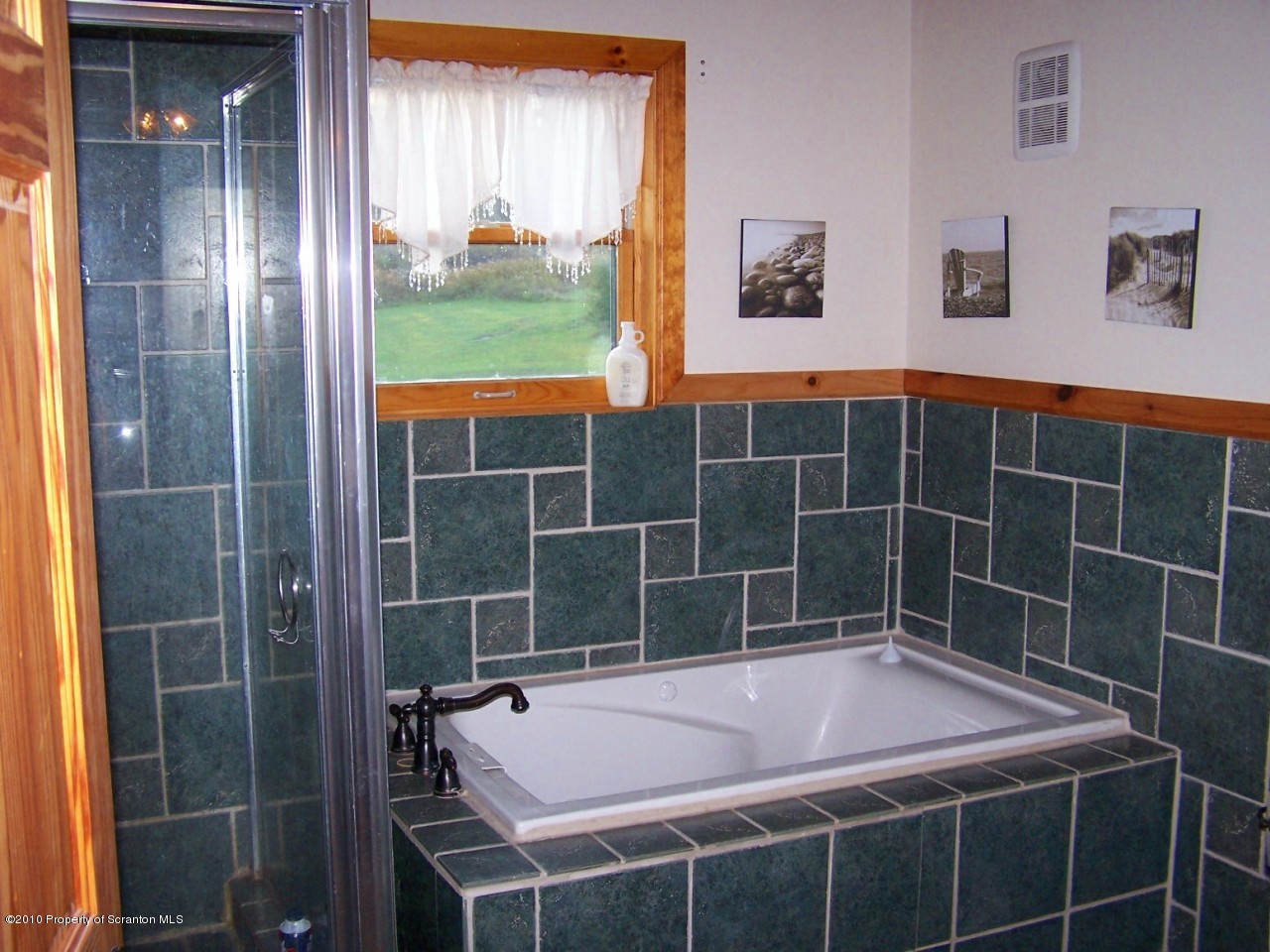 1018 Rattlesnake Hill Road Meshoppen, PA 18630 - Photo 17 of 26 a bathroom with a bathtub and window