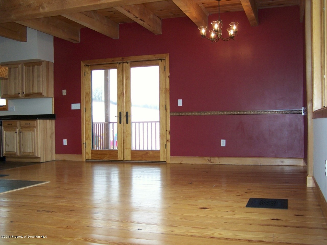 1018 Rattlesnake Hill Road Meshoppen, PA 18630 - Photo 8 of 26 a view of an empty room with wooden floor and a window