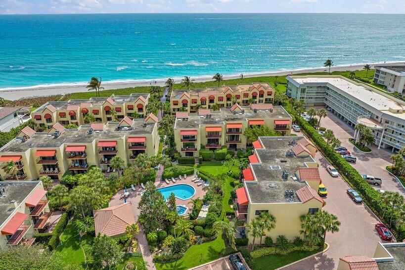 170 Celestial Way, Unit 33 Juno Beach, FL 33408 - Photo 1 of 51 a view of a city and an ocean view