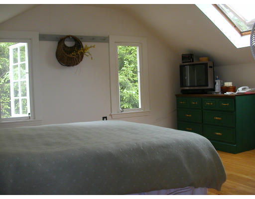302 Red Acre Road Stow, MA 01775 - Photo 5 of 6 a bedroom with a bed and a window