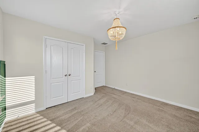 a view of a hallway with a rack on the wall