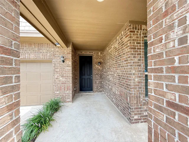 a view of front door of house with a street